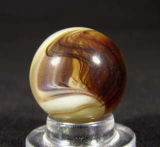 This is an awesome vintage Oxblood Swirl marble, possibly experimental 