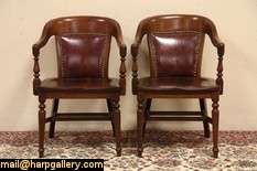 pair of traditional bank chairs are solid walnut from the 1920 s 