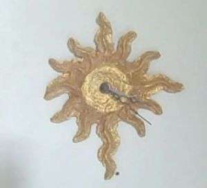 Sunburst battery operated paper mache clock in gold  