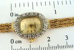   solid 14karat gold watch with 10 diamonds it is new old stock never