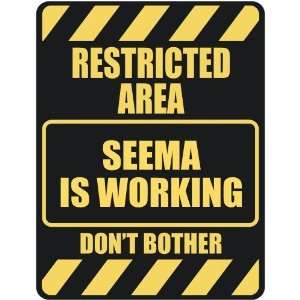   RESTRICTED AREA SEEMA IS WORKING  PARKING SIGN