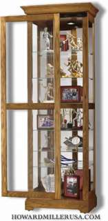 30  howard miller oak sliding door curio cabinet