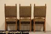 Six matched dining chairs are richly carved in solid oak and date from 